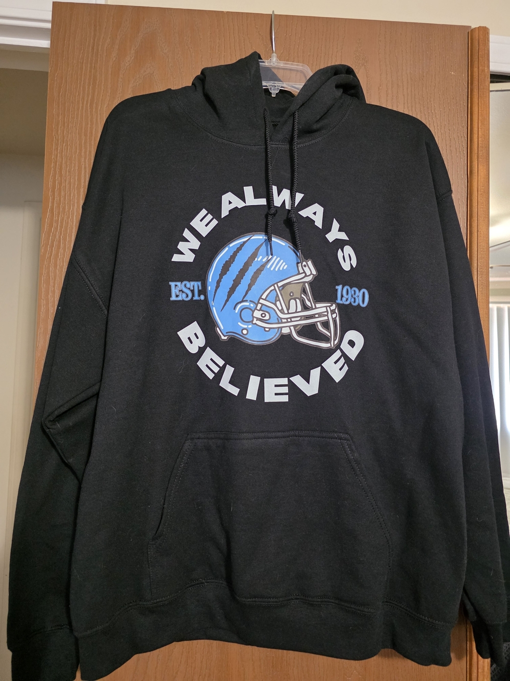 Detroit Lions Black Graphic Hoodie - 'We Always Believed' Blue Helmet Print